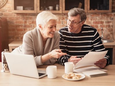 Elder Couple Discussing Home Economics Elder Couple Discussing Home Economics