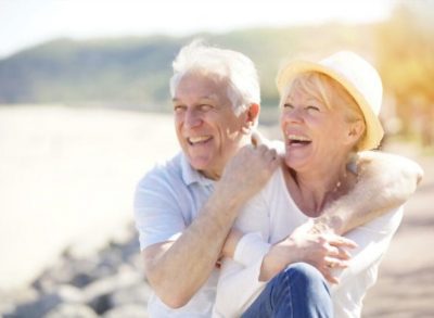 Happy Elder Couple at the Beach